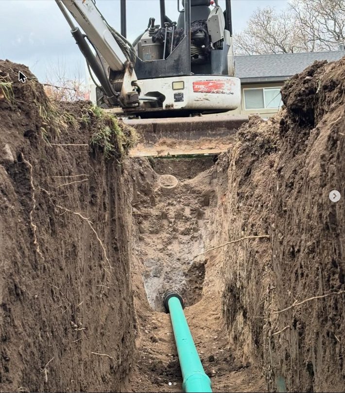 Deep excavation trench with sewer pipe
