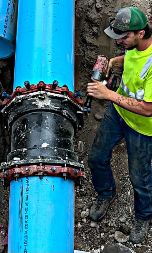 Downey's Excavation crew connecting a large waterline during a hookup job